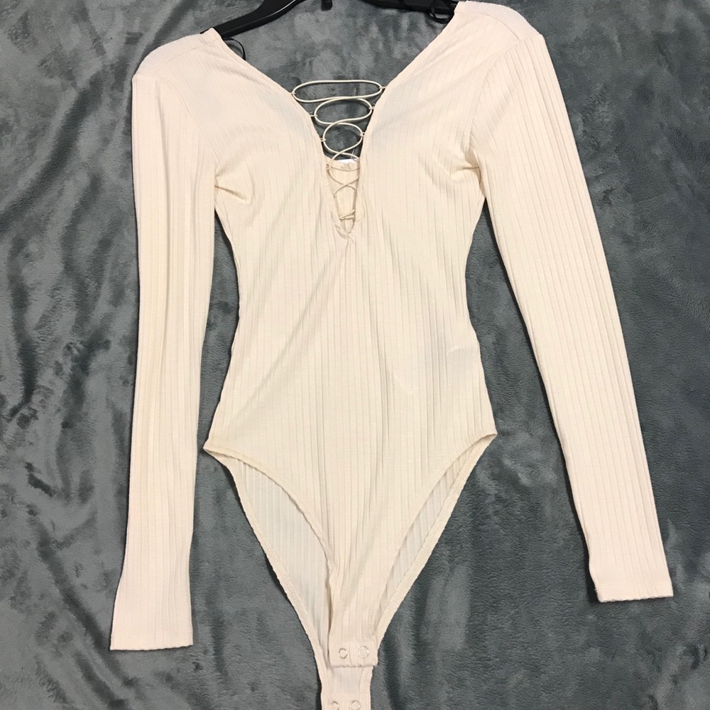 NWT cream bodysuit